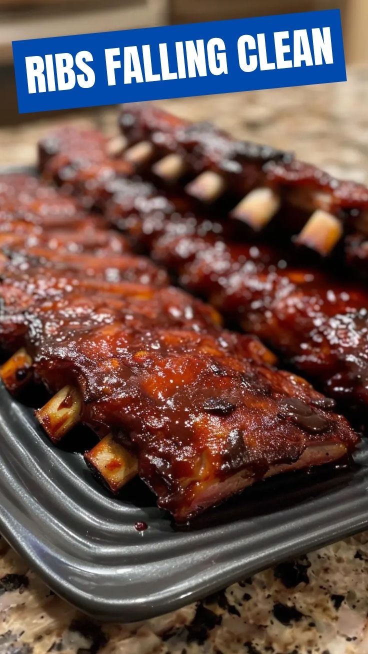 Close-up of succulent baby back ribs, glistening with sauce