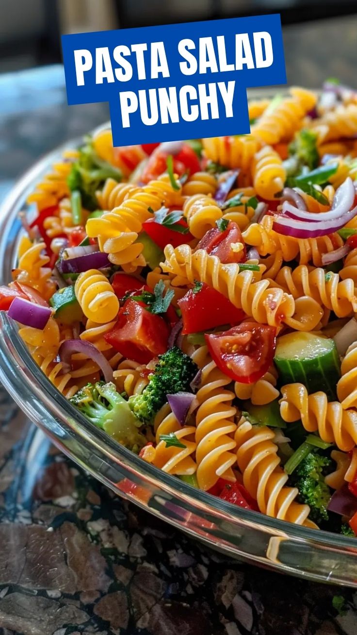 A bowl of fresh pasta salad with colorful vegetables