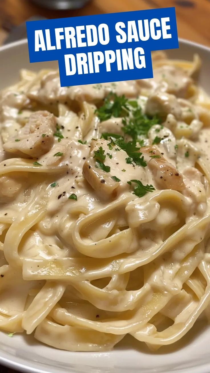 A bowl of chicken alfredo with tender chicken pieces and creamy sauce.