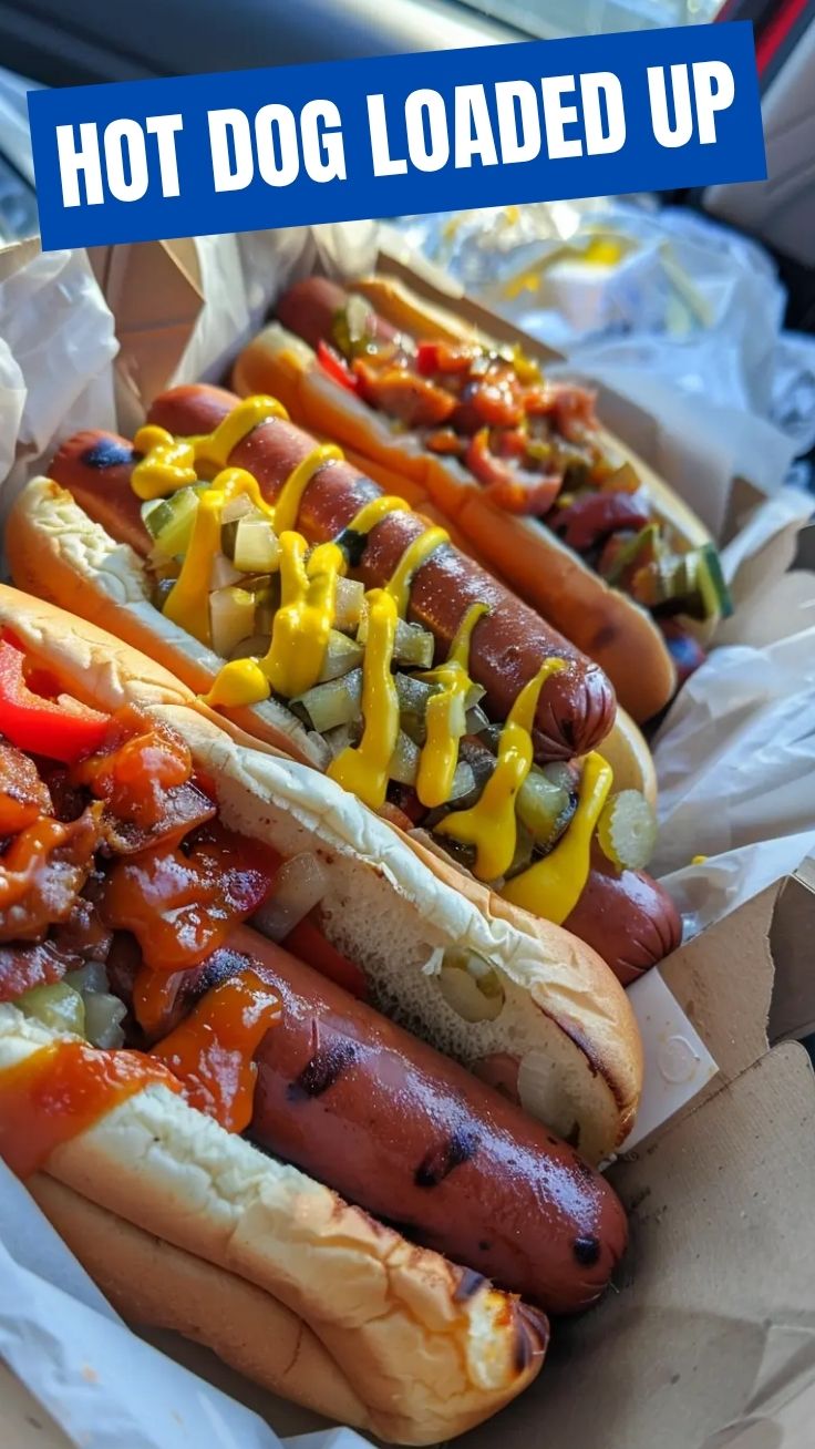 A perfectly grilled hot dog in a soft bun with classic toppings.