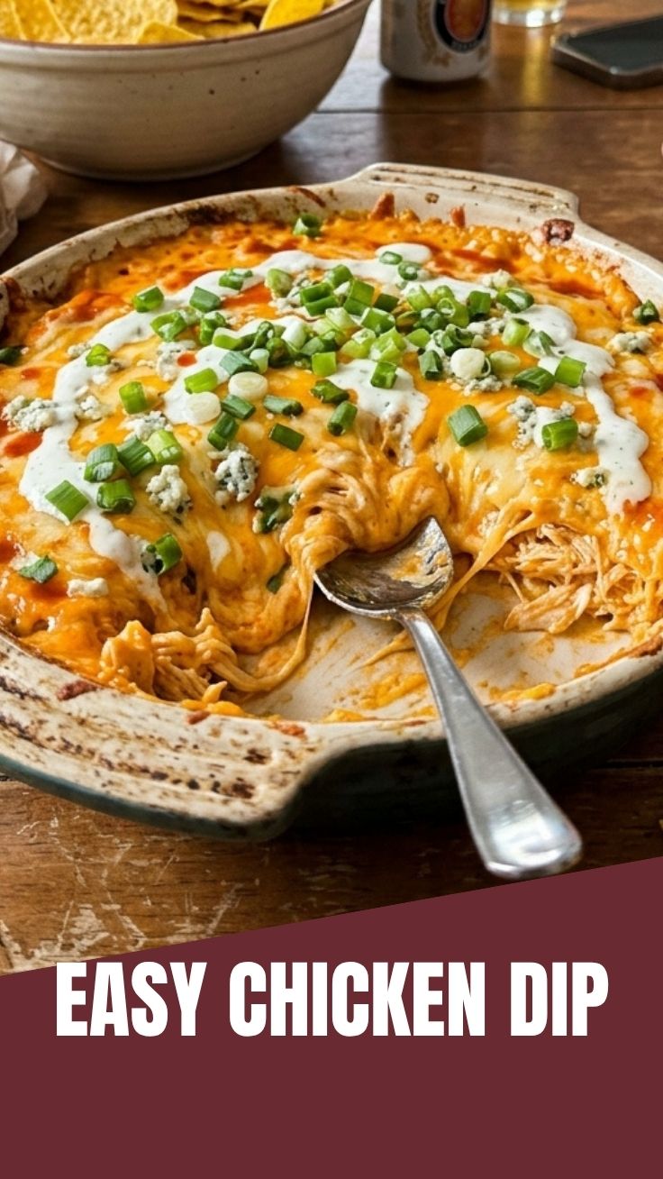 A hot and bubbly Buffalo Chicken Dip served in a ceramic dish.