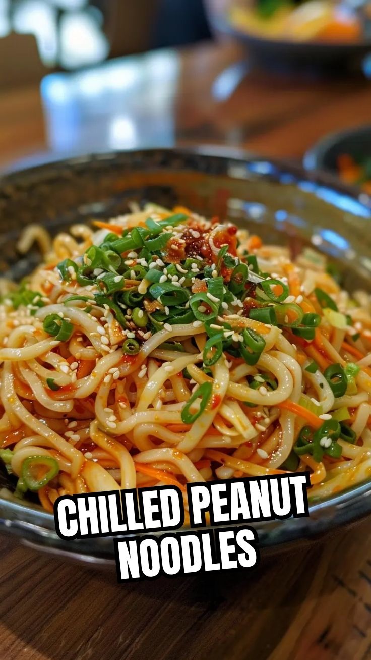 A vibrant cold noodle salad, Asian-style, with fresh vegetables and sesame seeds.