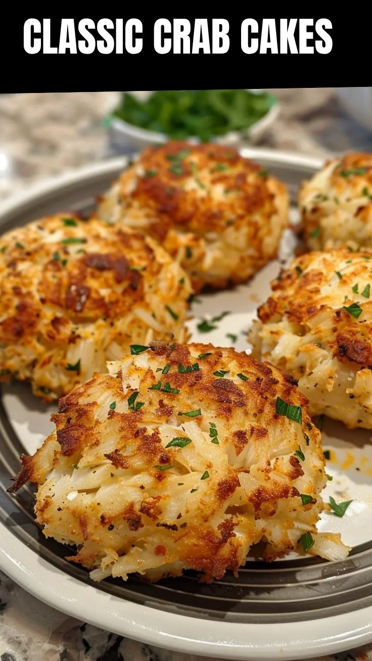 A plate showcasing several Maryland style crab cakes, perfectly golden-brown.