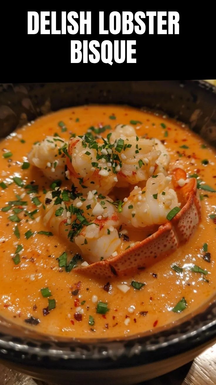 A steaming bowl of savory lobster bisque, artfully garnished with herbs.