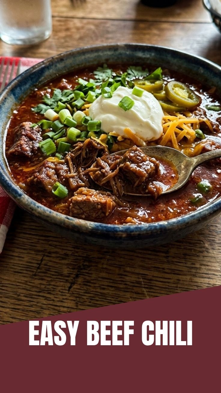 A bowl of rich, hearty Texas beef chili, garnished with fresh cilantro