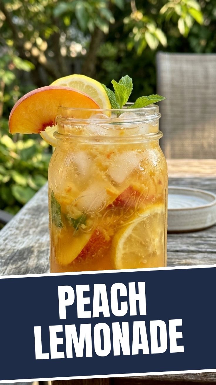 A glass of refreshing peach lemonade with ice and peach slices