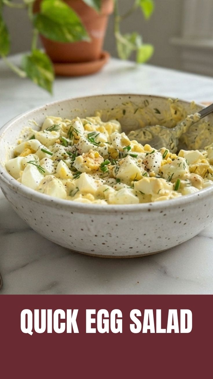 A bowl of fresh egg salad, ready to be served or eaten.