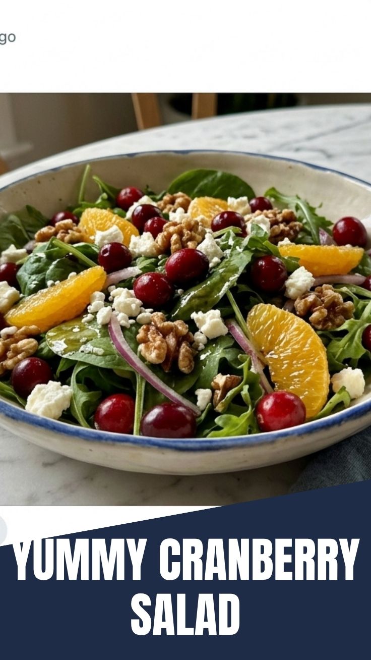 A bowl of fresh cranberry salad with mixed greens.